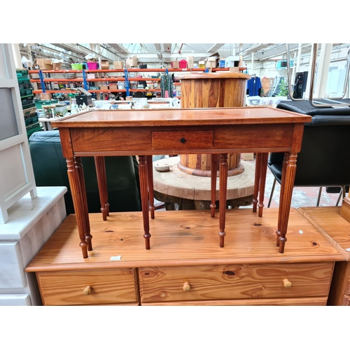 1113 - A late 20th century mahogany nest of three tables - approx. 52cm high x 81cm wide x 41cm deep