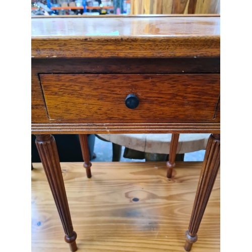 1113 - A late 20th century mahogany nest of three tables - approx. 52cm high x 81cm wide x 41cm deep