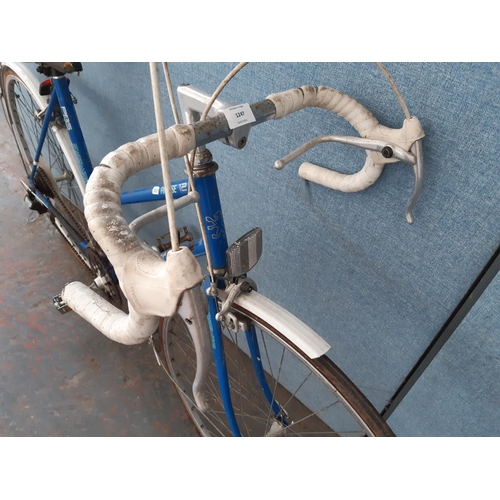 1247 - A vintage blue Peugeot lady's road bike with quick release front wheel and 12 speed Arris gear syste... 