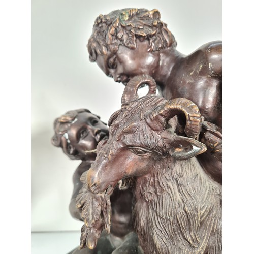 458 - A pair of mid 20th century French school bronze sculptures with bacchic putti fawning over sacrifici... 