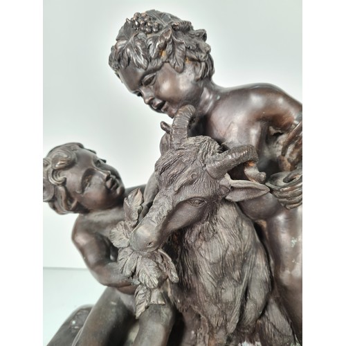 458 - A pair of mid 20th century French school bronze sculptures with bacchic putti fawning over sacrifici... 