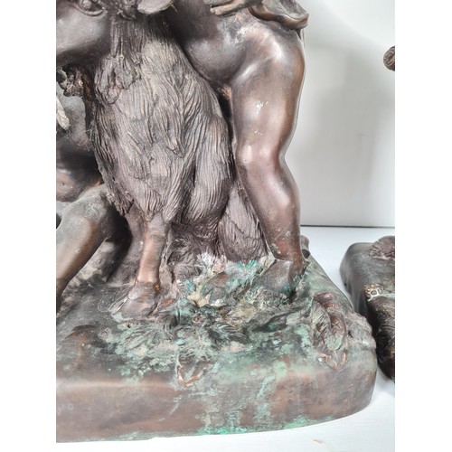 458 - A pair of mid 20th century French school bronze sculptures with bacchic putti fawning over sacrifici... 