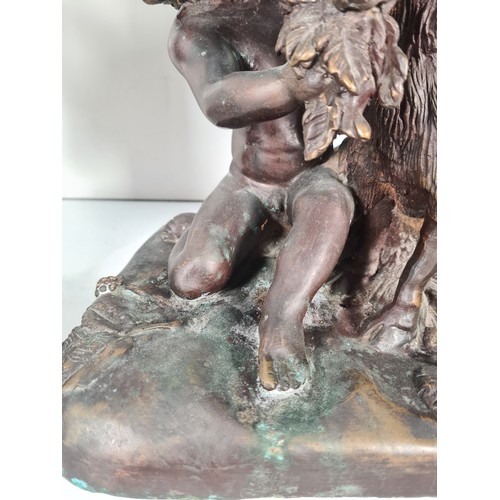 458 - A pair of mid 20th century French school bronze sculptures with bacchic putti fawning over sacrifici... 