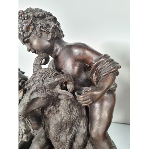 458 - A pair of mid 20th century French school bronze sculptures with bacchic putti fawning over sacrifici... 