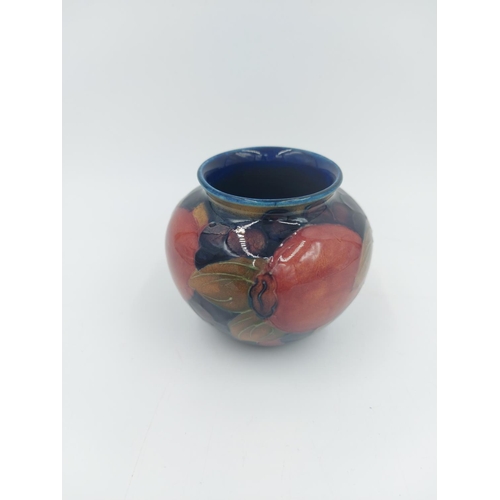 469 - A Moorcroft Pottery vase in the Pomegranate design - approx. 7cm high