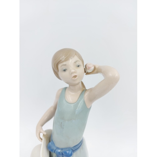 464 - A Lladro Prissy Coiffure Girl With Hat figurine, ref no. 5010 - approx. 24cm high