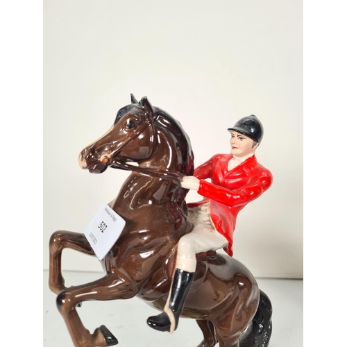 502 - Three Beswick figurines to include The Huntsman - model no. 868, Huntsman - model no. 1501 and Hunts... 