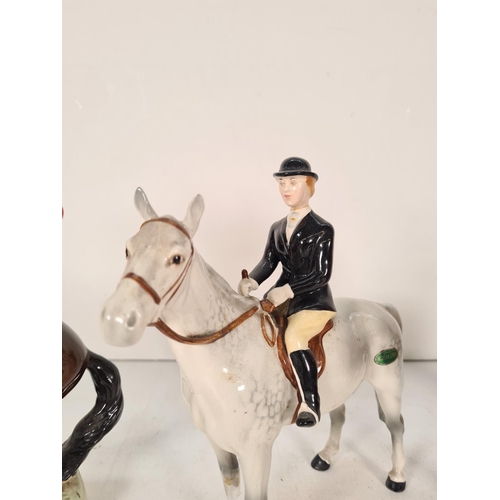 502 - Three Beswick figurines to include The Huntsman - model no. 868, Huntsman - model no. 1501 and Hunts... 