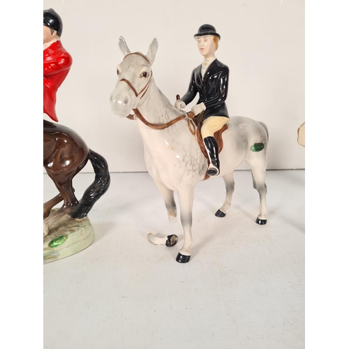 502 - Three Beswick figurines to include The Huntsman - model no. 868, Huntsman - model no. 1501 and Hunts... 