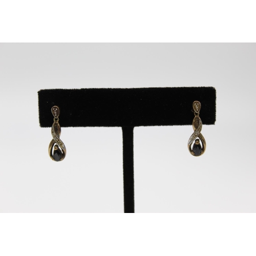 102 - A pair of 9ct gold gemstone and diamond drop earrings - approx. gross weight 2.1 grams