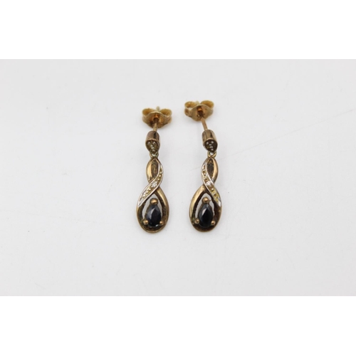 102 - A pair of 9ct gold gemstone and diamond drop earrings - approx. gross weight 2.1 grams