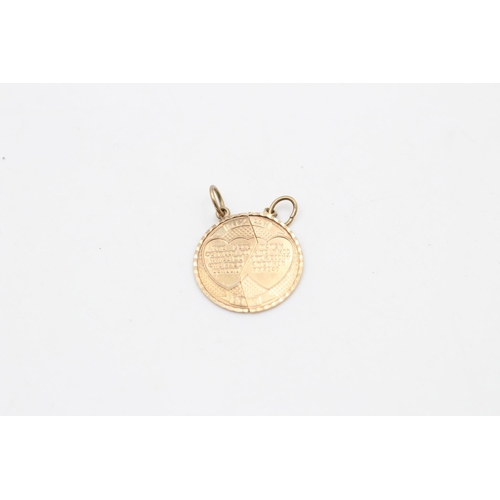 110 - A pair of 9ct gold Mizpah pendants - approx. gross weight 1.5 grams