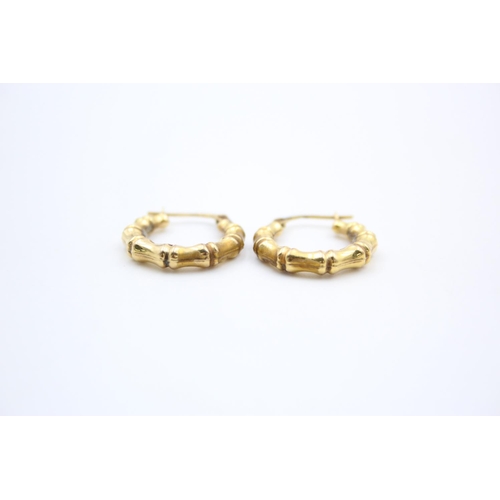 136 - A pair of 9ct gold bamboo hoop earrings - approx. gross weight 1.3 grams