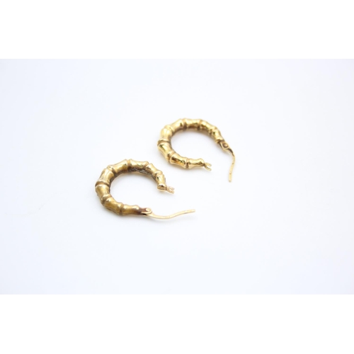 136 - A pair of 9ct gold bamboo hoop earrings - approx. gross weight 1.3 grams