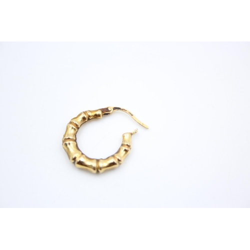 136 - A pair of 9ct gold bamboo hoop earrings - approx. gross weight 1.3 grams