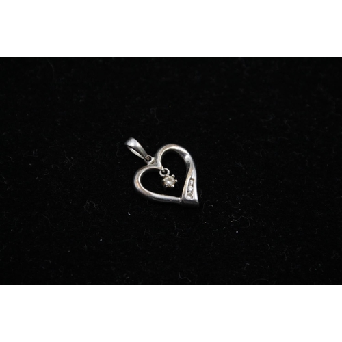 140 - Two 9ct white gold heart pendants to include one diamond - approx. gross weight 1.4 grams