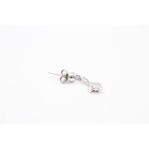 141 - A pair of 9ct white gold diamond drop earrings - approx. gross weight 1.6 grams