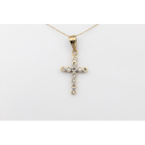 144 - A 9ct gold diamond cross pendant necklace - approx. gross weight 1.6 grams