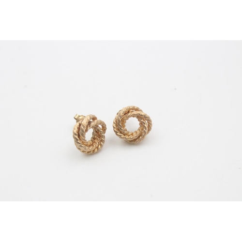17 - A pair of 9ct gold knot stud earrings - approx. gross weight 2.9 grams