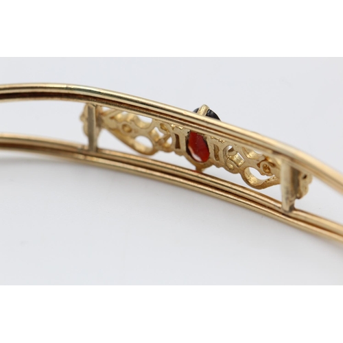 182 - An Edwardian 9ct gold ornate garnet open bangle - approx. gross weight 3.7 grams