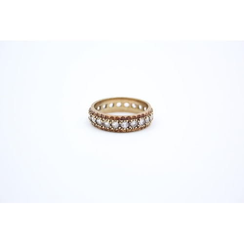 187 - A 9ct gold gemstone full eternity ring - approx. gross weight 3.9 grams