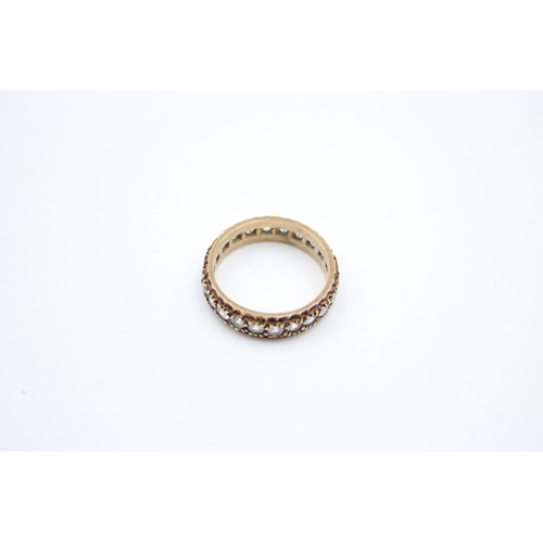 187 - A 9ct gold gemstone full eternity ring - approx. gross weight 3.9 grams