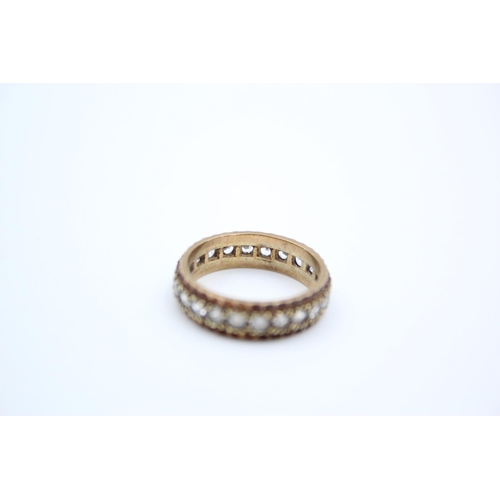 187 - A 9ct gold gemstone full eternity ring - approx. gross weight 3.9 grams