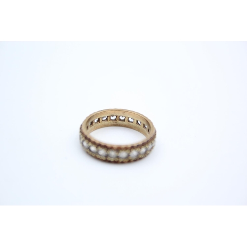 187 - A 9ct gold gemstone full eternity ring - approx. gross weight 3.9 grams