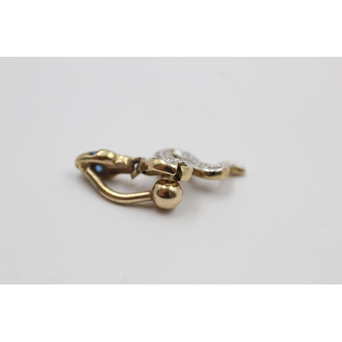 189 - A 9ct gold and gemstone snake belly button bar - approx. gross weight 3.3 grams