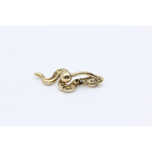 189 - A 9ct gold and gemstone snake belly button bar - approx. gross weight 3.3 grams