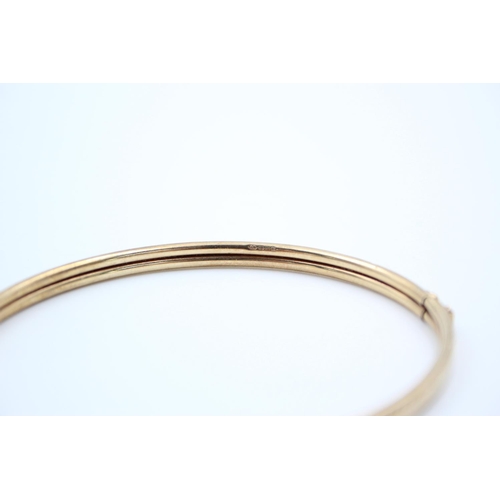 190 - A 9ct gold textured bangle - approx. gross weight 5.2 grams