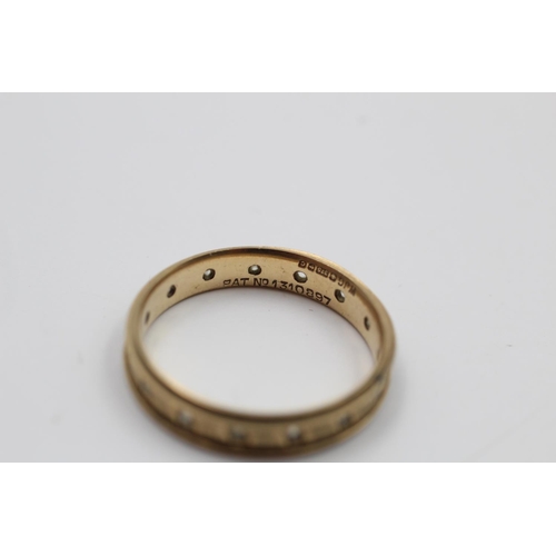 207 - A 9ct gold textured gemstone eternity ring - approx. gross weight 2.2 grams