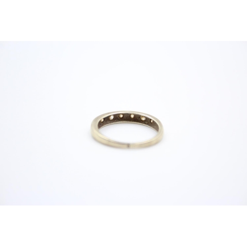 217 - A 9ct gold gemstone half eternity ring - approx. gross weight 1.6 grams