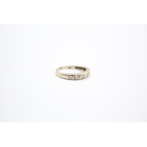 217 - A 9ct gold gemstone half eternity ring - approx. gross weight 1.6 grams