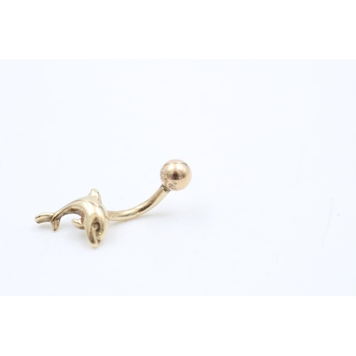 220 - A 9ct gold dolphin belly button bar - approx. gross weight 1.3 grams