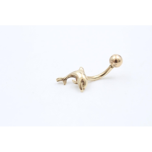 220 - A 9ct gold dolphin belly button bar - approx. gross weight 1.3 grams