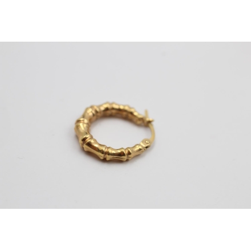 223 - A pair of 9ct gold bamboo hoop earrings - approx. gross weight 1.2 grams