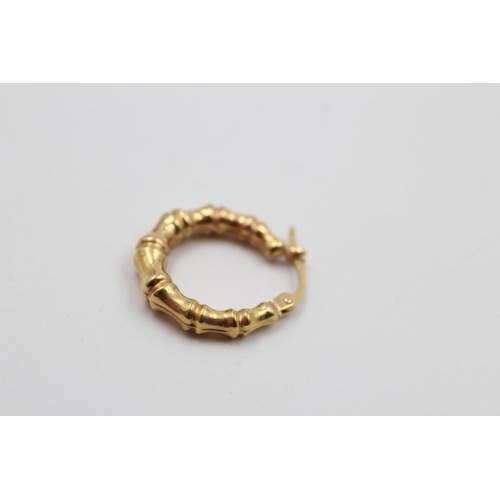 223 - A pair of 9ct gold bamboo hoop earrings - approx. gross weight 1.2 grams