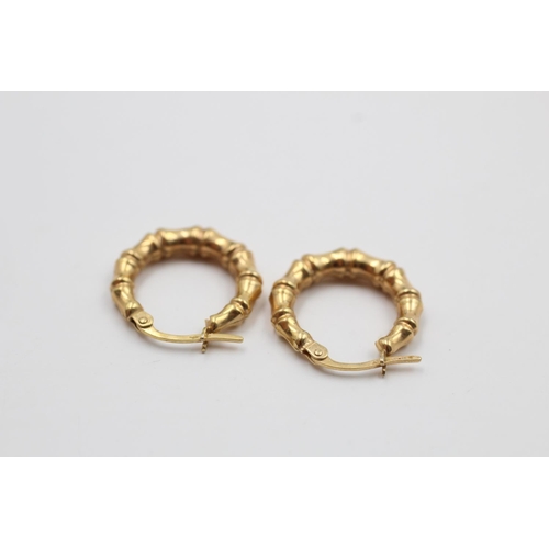 223 - A pair of 9ct gold bamboo hoop earrings - approx. gross weight 1.2 grams