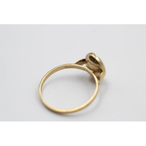 231 - A 9ct gold lucky coffee bean ring - approx. gross weight 0.9 grams