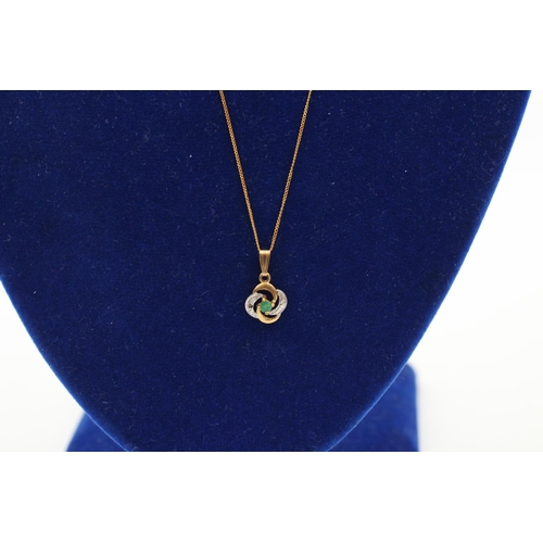 233 - A 9ct gold diamond and emerald pendant necklace - approx. gross weight 0.9 grams