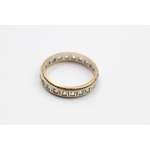 242 - A 9ct gold bicolour gemstone full eternity ring - approx. gross weight 3.8 grams