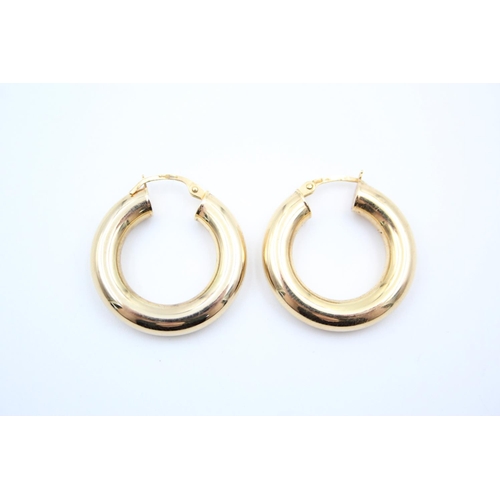 26 - A pair of 9ct gold chunky hoop earrings - approx. gross weight 2.7 grams