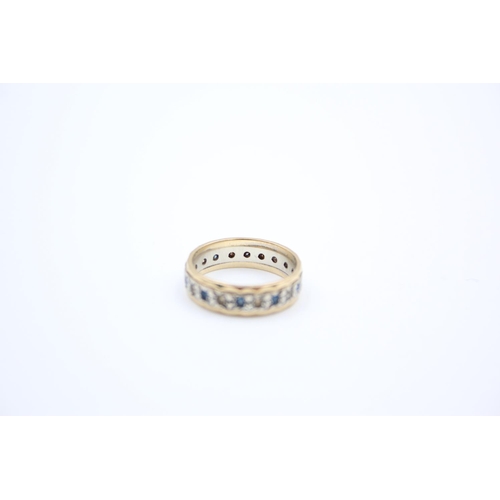 38 - A 9ct gold gemstone full eternity ring - approx. gross weight 2.8 grams