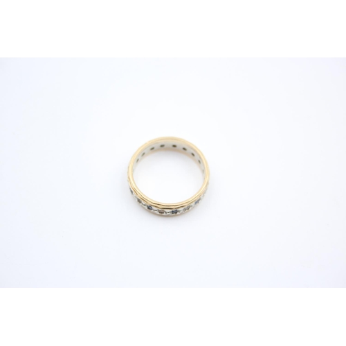 38 - A 9ct gold gemstone full eternity ring - approx. gross weight 2.8 grams