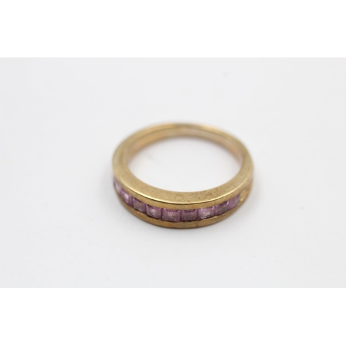 5 - A 9ct gold pink gemstone set half eternity ring - approx. gross weight 3.8 grams