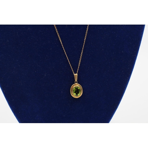 83 - A 9ct gold peridot pendant necklace - approx. gross weight 2.2 grams
