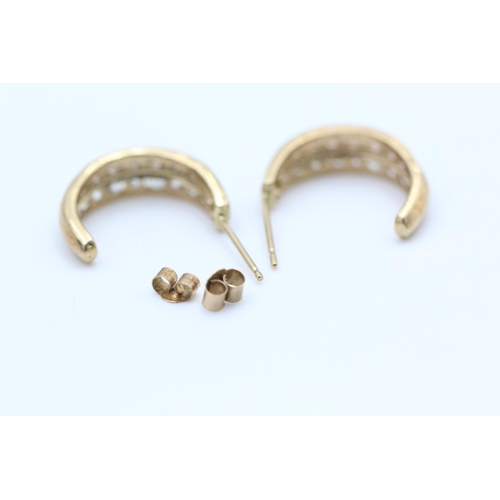 90 - A pair of 9ct gold gemstone channel set half hoop earrings - approx. gross weight 2.7 grams