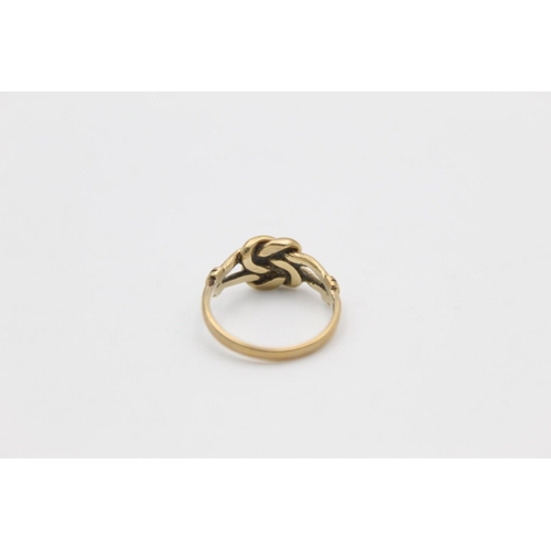 91 - A hallmarked Sheffield 9ct gold knot ring - approx. gross weight 1.7 grams