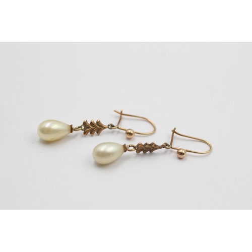 93 - A pair of 9ct gold ornate faux pearl drop earrings - approx. gross weight 2.1 grams